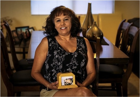 Martina keeps Pockets' ashes in a small wooden box with his photo Credit: 12 News Phoenix.